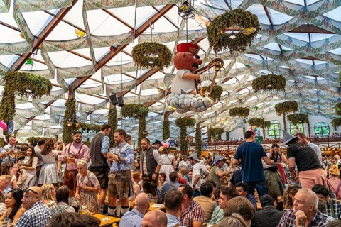 Visitors in the Hofbräu marquee at the Oktoberfest 2024 in Munich, Bavaria, Germany