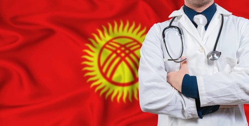 Male doctor with stethoscope on Kyrgyzstan flag. Doctor holding stethoscope on Kyrgyzstan flag
