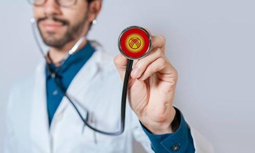 Doctor holding stethoscope with Kyrgyzstan flag. Kyrgyzstan health and care concept, Kyrgyzstan