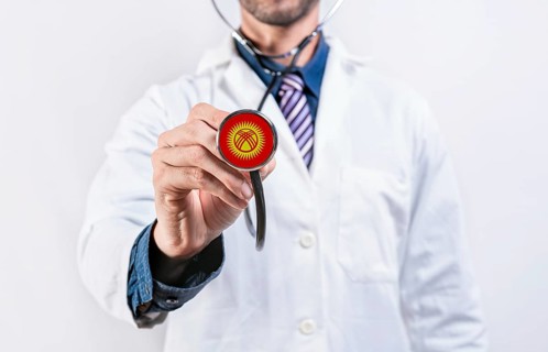 Kyrgyzstan healthcare system, doctor holding stethoscope. Kyrgyzstan health and medical insurance