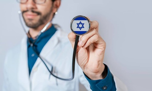 Doctor holding stethoscope with Israel flag. Israel health and care concept, Israel flag on