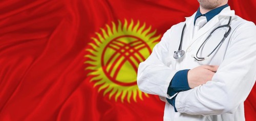 Kyrgyzstan healthcare concept. Male doctor on Kyrgyzstan flag. Doctor with crossed arms on