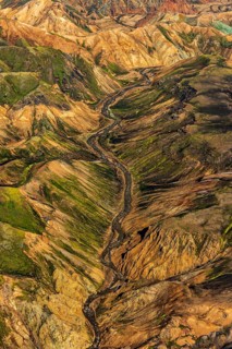 Mountain landscape, snowfields, river, valley, sunny, summer, volcanic landscape, aerial view,