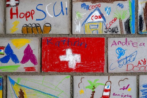Brick wall painted by schoolchildren, Interlaken, Switzerland