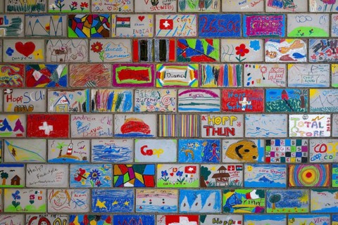 Brick wall painted by schoolchildren, Interlaken, Switzerland