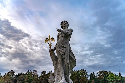 Statue of Hermes or Mercurius in the park of Nymphenburg Palace in Munich, Bavaria, Germany