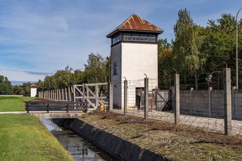 Camp fence and watchtower, Dachau Concentration Camp Memorial, Bavaria, Germany