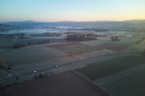 Agricultural fields and meadows in the early morning fog, Reuss Valley, Merenschwand, Freiamt,