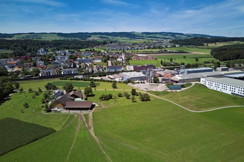 View of the village with the catholic parish church Mariä Geburt, on the right the industrial area,