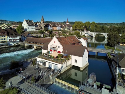 Old town with the tower of the Muri- Amthof, in the foreground the weir and the museum