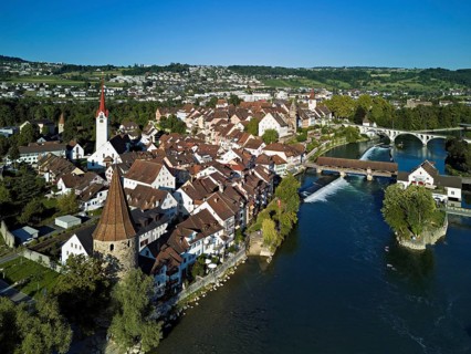 Old town with the Catholic Church of St. Nicholas, the tower of the Muri- Amthof and the witches'