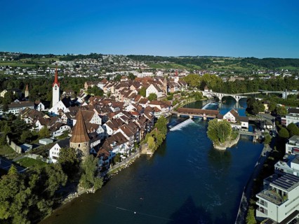Old town with the Catholic Church of St. Nicholas, the tower of the Muri- Amthof and the witches'