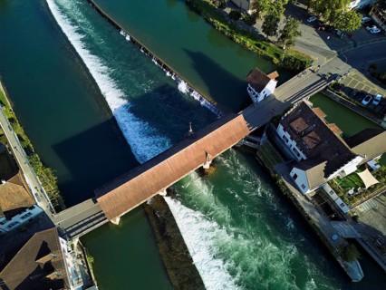 Old wooden bridge from above with the weir on the river Reuss, Bremgarten, Freiamt, Canton, Aargau,