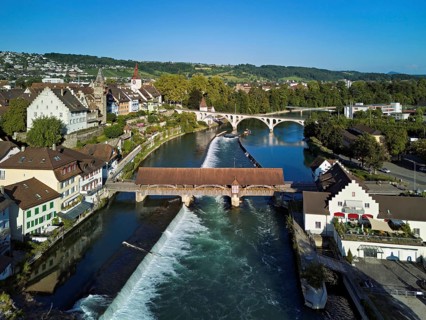 Old town with the tower of the Muri- Amthof, in the foreground the weir and the old wooden bridge