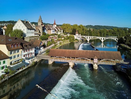 Old town with the tower of the Muri- Amthof, in the foreground the weir and the old wooden bridge