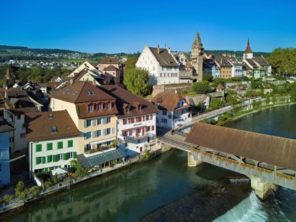 Old town with the tower of the Muri- Amthof, in the foreground the weir and the old wooden bridge