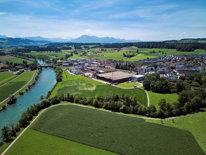 View of the village, industrial area on the right, Pilatus in the background, Sins, Freiamt, Canton