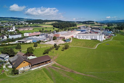 Industrial area and the village with the catholic parish church Mariä Geburt, Sins, Freiamt,