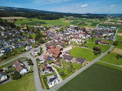 View of the village with the Roman Catholic parish church of St Anna, behind the Lindenberg,