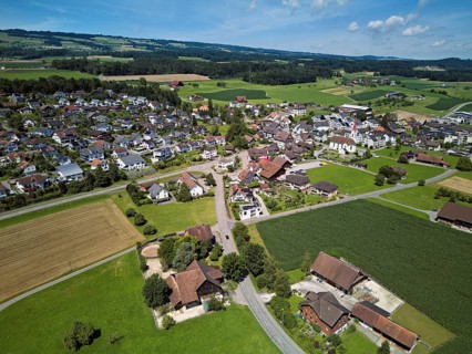 View of the village with the Roman Catholic parish church of St Anna, behind the Lindenberg,