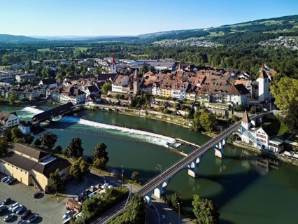 Old town with the Catholic Church of St. Nicholas and the tower of the Muri- Amthof, in the