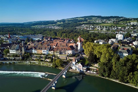 Old town with the Catholic Church of St. Nicholas and the tower of the Muri- Amthof, in the