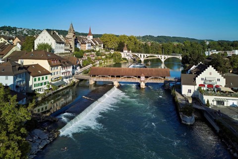 Old town with the tower of the Muri- Amthof, in the foreground the weir and the old wooden bridge