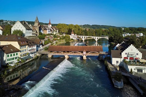 Old town with the tower of the Muri- Amthof, in the foreground the weir and the old wooden bridge