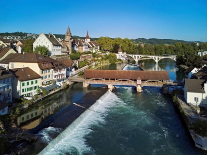 Old town with the tower of the Muri- Amthof, in the foreground the weir and the old wooden bridge