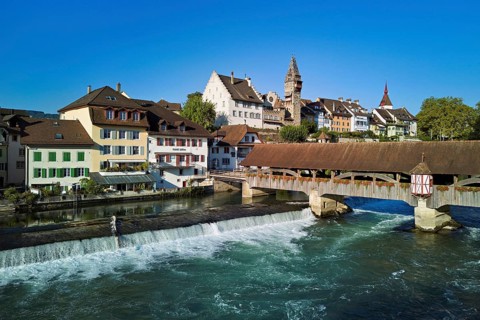 Old town with the tower of the Muri- Amthof, in the foreground the weir and the old wooden bridge