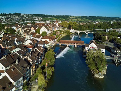 Old town with the tower of the Muri- Amthof, in the centre the weir and the old wooden bridge