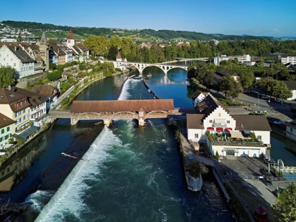 Old town with the tower of the Muri- Amthof, in the foreground the weir and the old wooden bridge