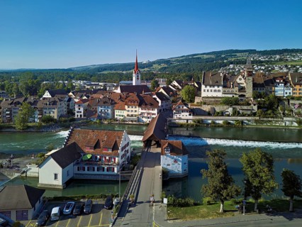 Old town with the Catholic Church of St Nicholas and the tower of the Muri- Amthof, in the