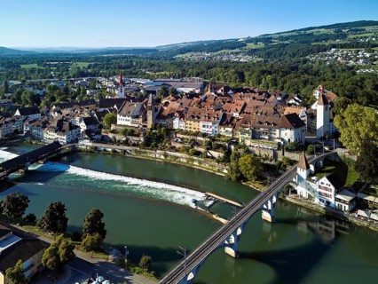 Old town with the Catholic Church of St. Nicholas and the tower of the Muri- Amthof, in the