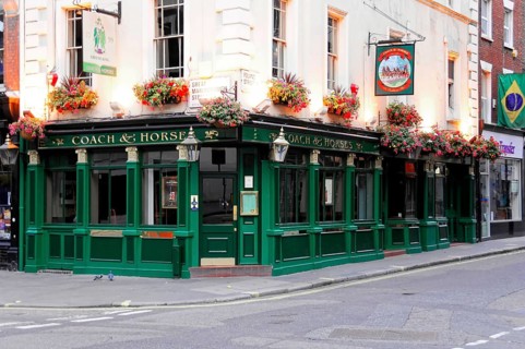 London, England, Great Britain, Europe, Traditional British pub façade with green painting and