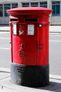 Red letterbox on an empty London street, London, London region, England, United Kingdom