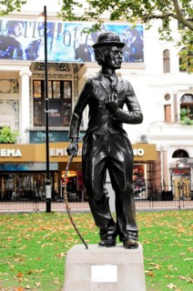 London, England, Great Britain, Europe, Bronze statue of Charlie Chaplin in front of a cinema in a