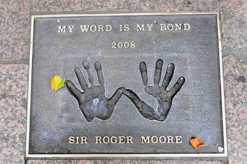 Plaque with handprints and the inscription by Sir Roger Moore, My Word Is My Bond 2008, London,