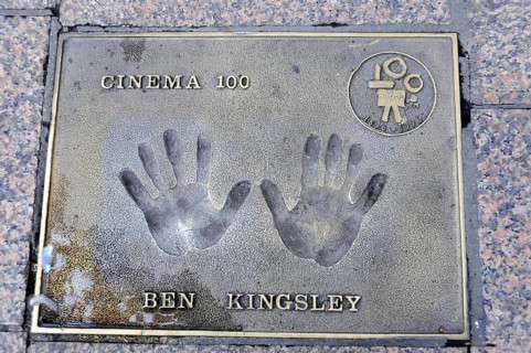 Ben Kingsley's handprints for Cinema 100 on a metal plate in the pavement, London, England, Great