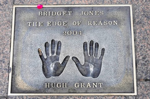Handprints of Hugh Grant for the film Bridget Jones on a metal plate on the pavement, London,