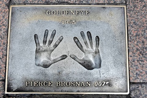 Handprints of Pierce Brosnan for the film GoldenEye on a metal plate on the pavement, London,