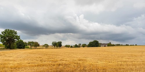 Stormy farmland scenery in Hohenlohe, an area in Southern Germany at late summer time