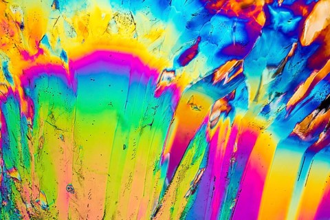Colorful microscopic shot of Trisodium citrate microcrystals in polarized light