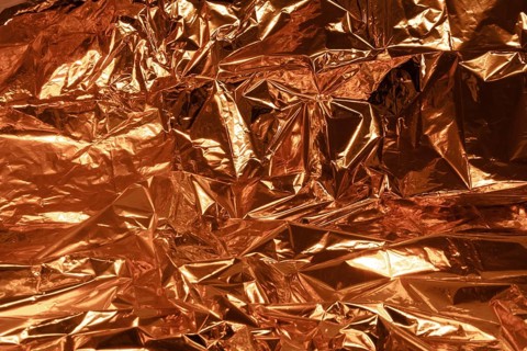 Full frame creased copper foil background