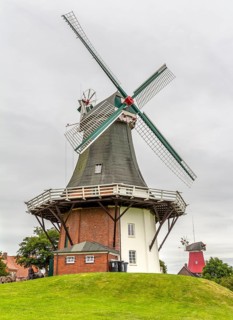 The twin windmills in Greetsiel, a idyllic village located in East Frisia, Northern Germany