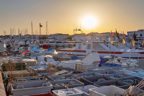 Harbor of Saintes-Maries-de-la-Mer, the capital of the camargue in the south of France at evening