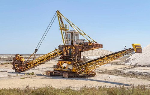 Bucket-wheel excavator near a salt production facility around Salin-de-Giraud located in in the