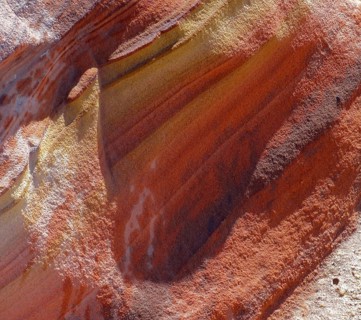 Detail of a a colorful rock formation in the Libyan Desert