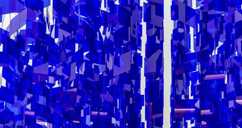 Full frame abstract background showing lots of hanging blue glass sheets