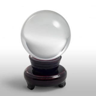A clear crystal ball and stand in light grey gradient back